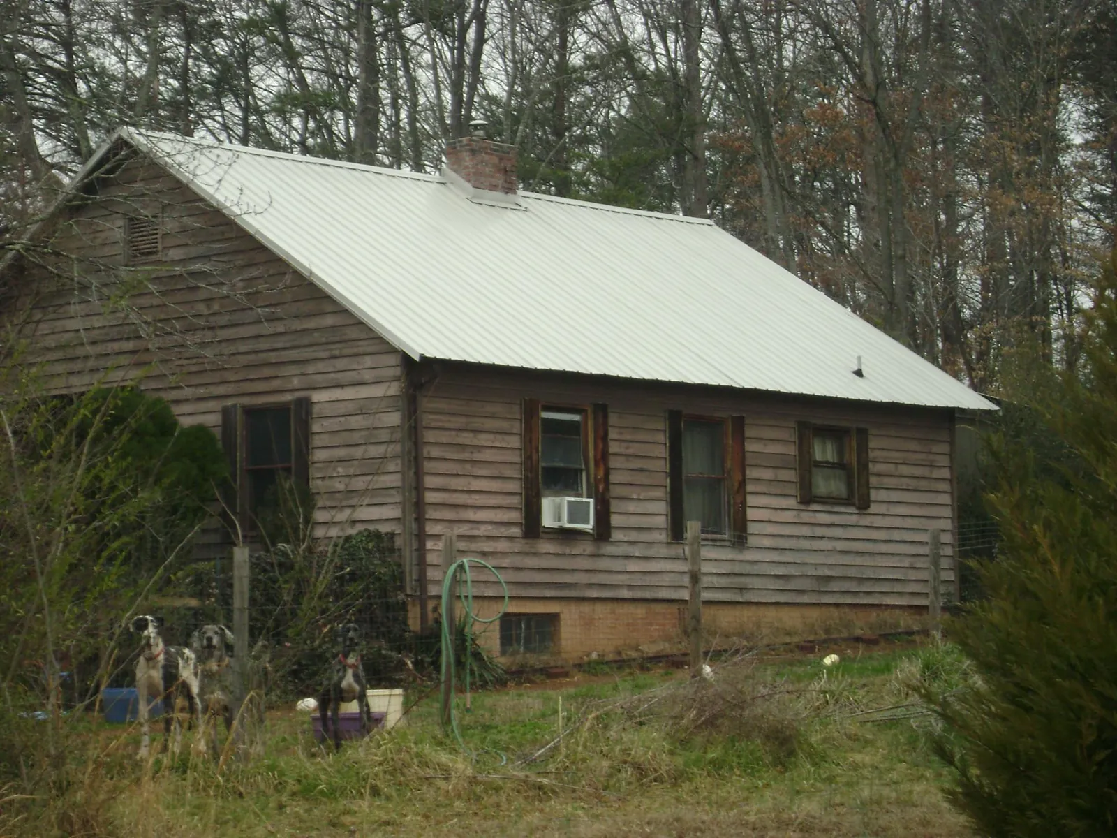 White metal roof on an old wood sided farmhouse, from a Metal Roof Installation job in Ivoryton